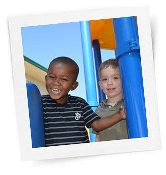 Two children on a playground structure