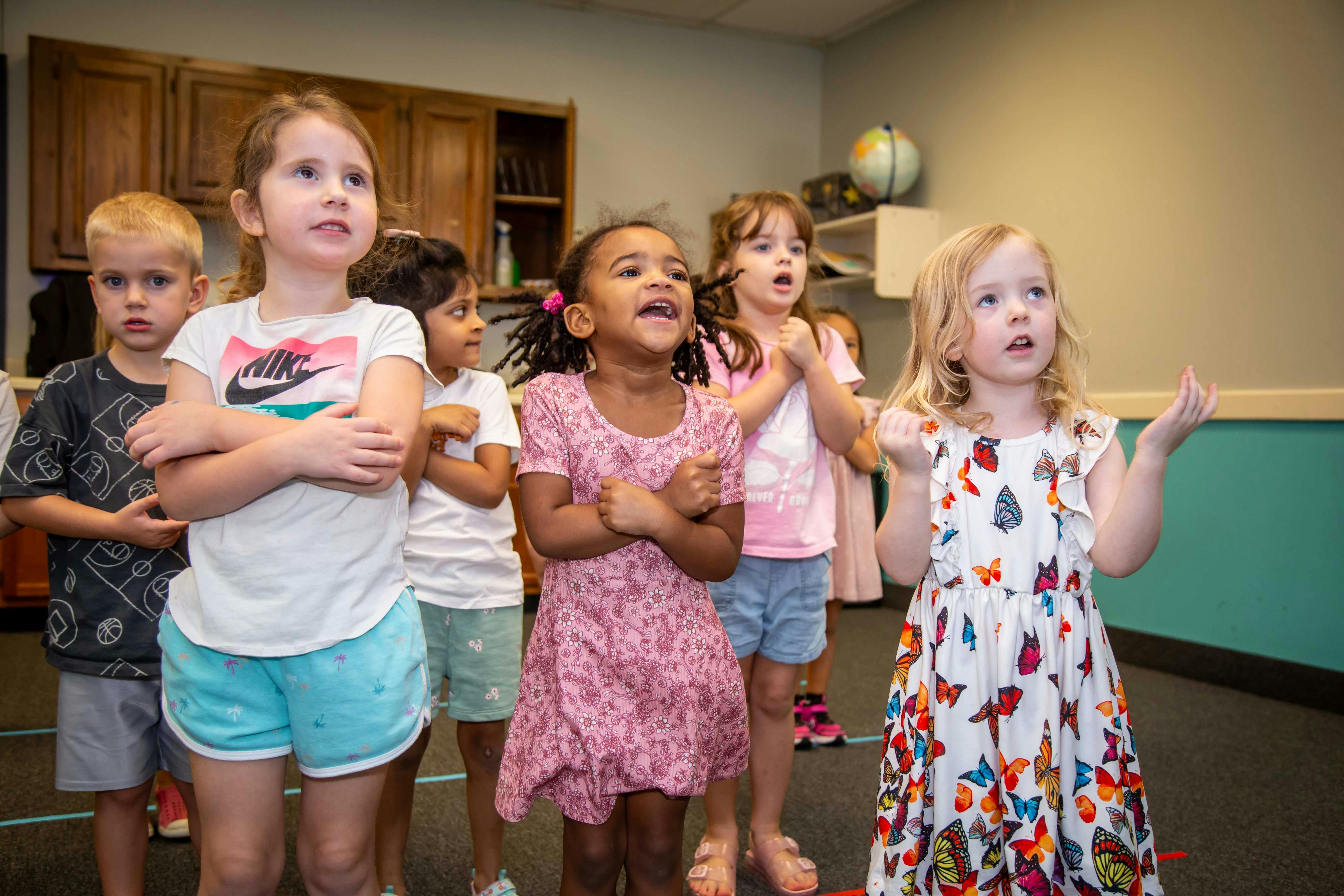 Group of children standing and looking up