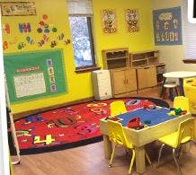 Child's play area with colorful rug and activity table