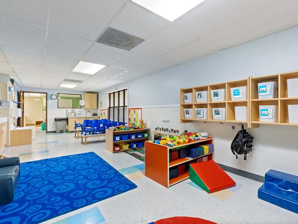 Classroom with child-sized furniture and toys