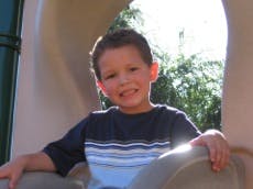 Child sitting in a play structure
