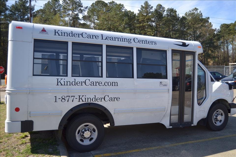 White KinderCare Learning Centers shuttle bus