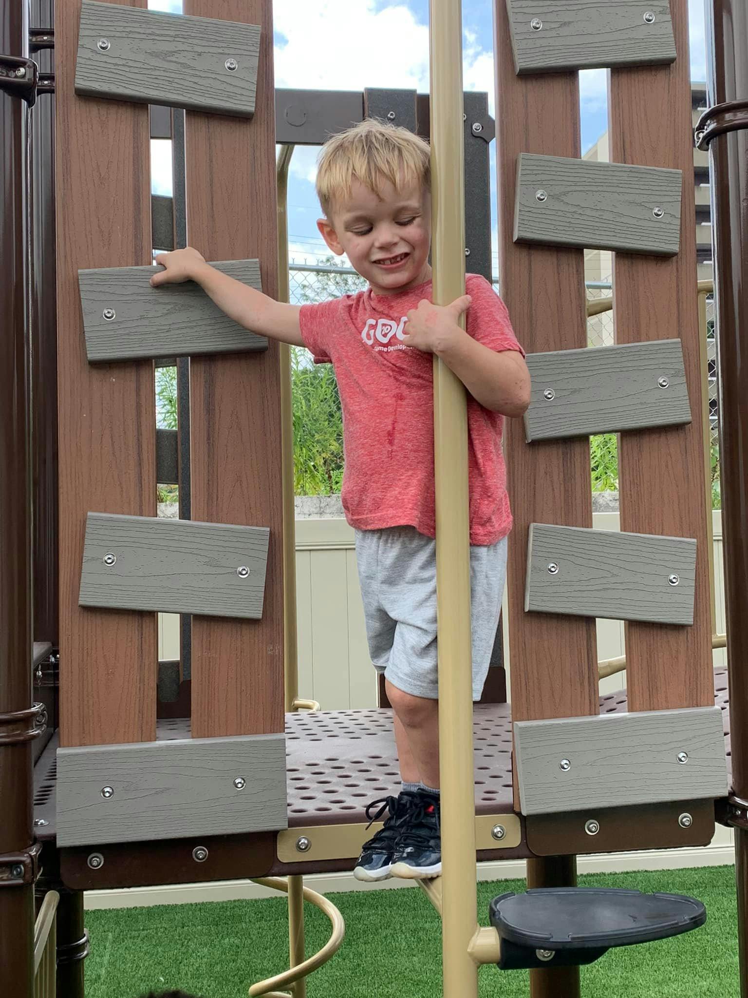 Child on a playground structure