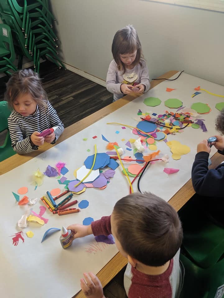 Children doing crafts at a table