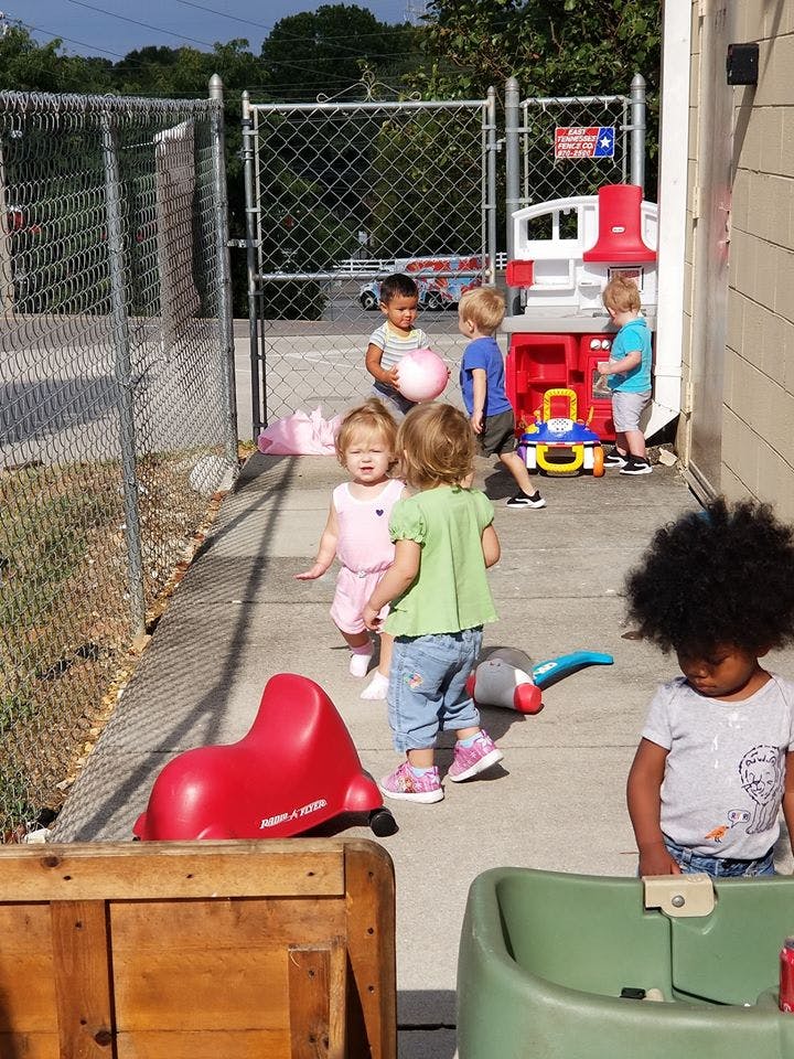 Children playing with toys outdoors