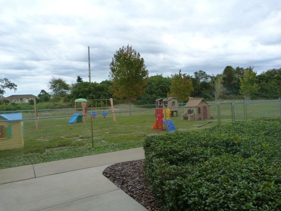 Playground with swings, slides, and playhouses