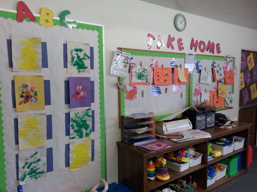 Classroom with children's artwork displayed on bulletin boards