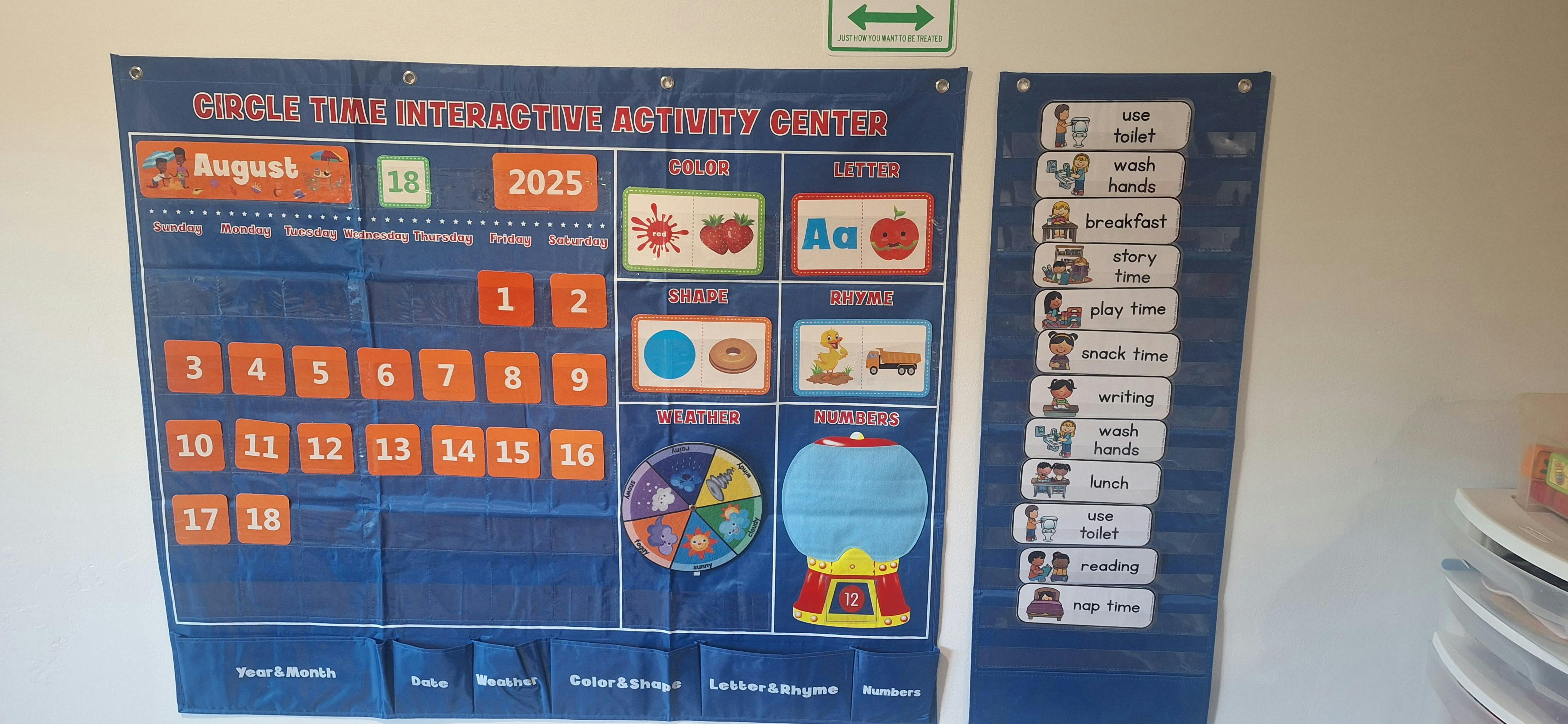 two blue interactive wall charts for children with a calendar and daily schedule