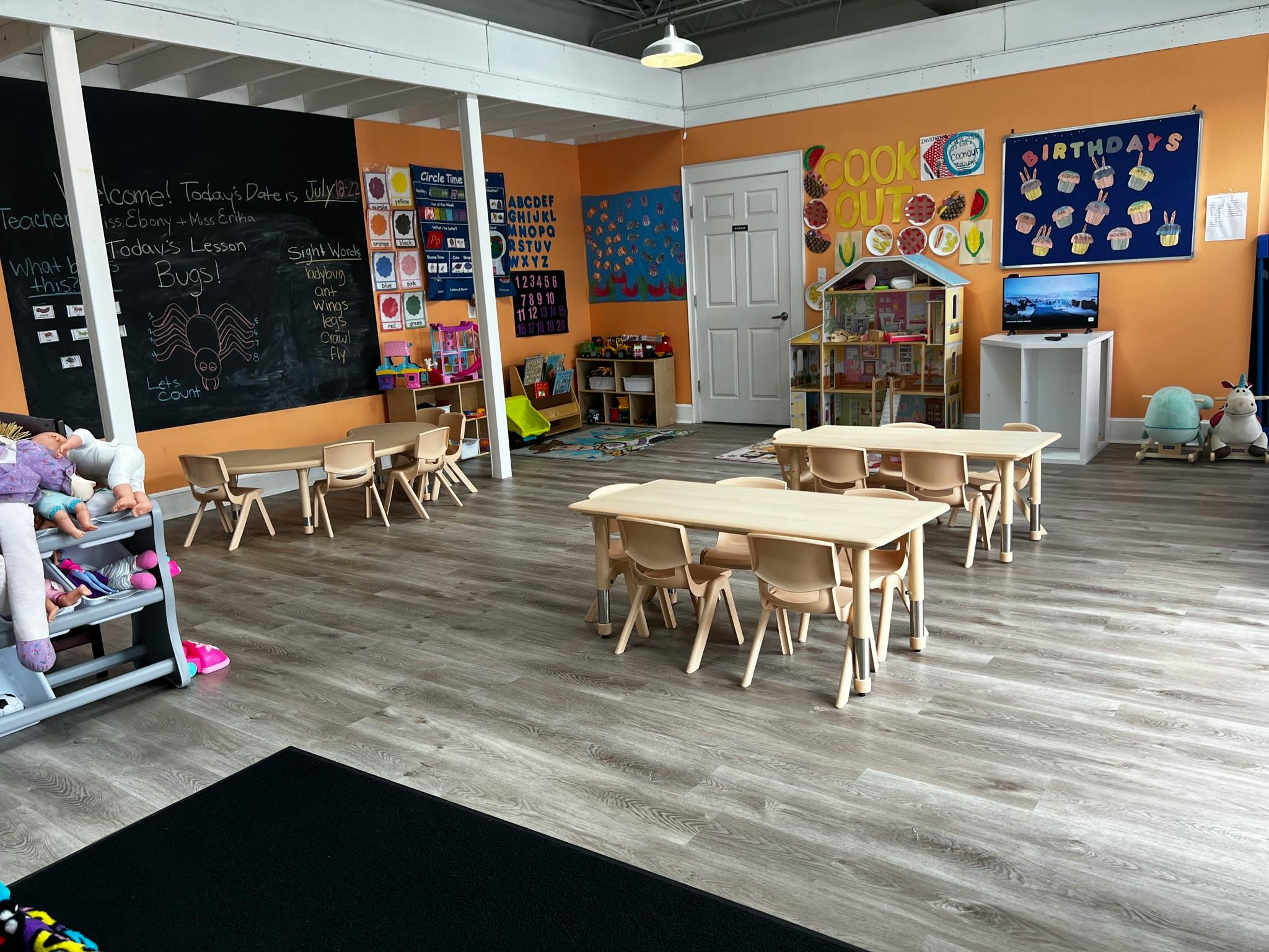 Empty classroom with small tables and chairs