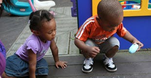 Two children playing outdoors
