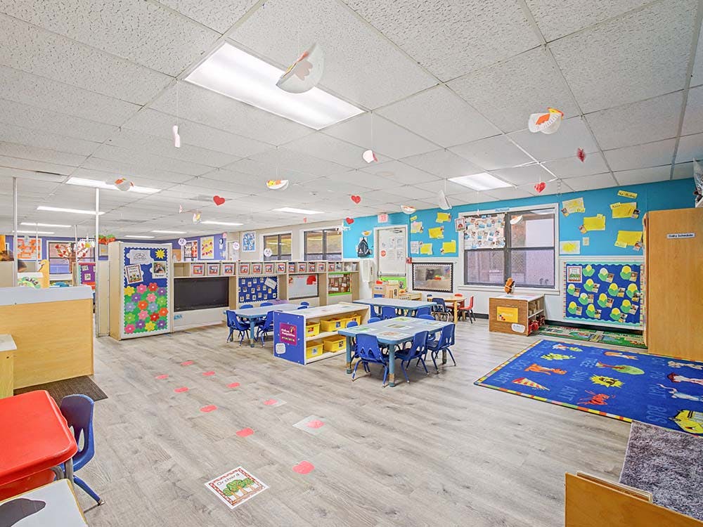 Classroom with tables, chairs, decorations on walls and ceiling