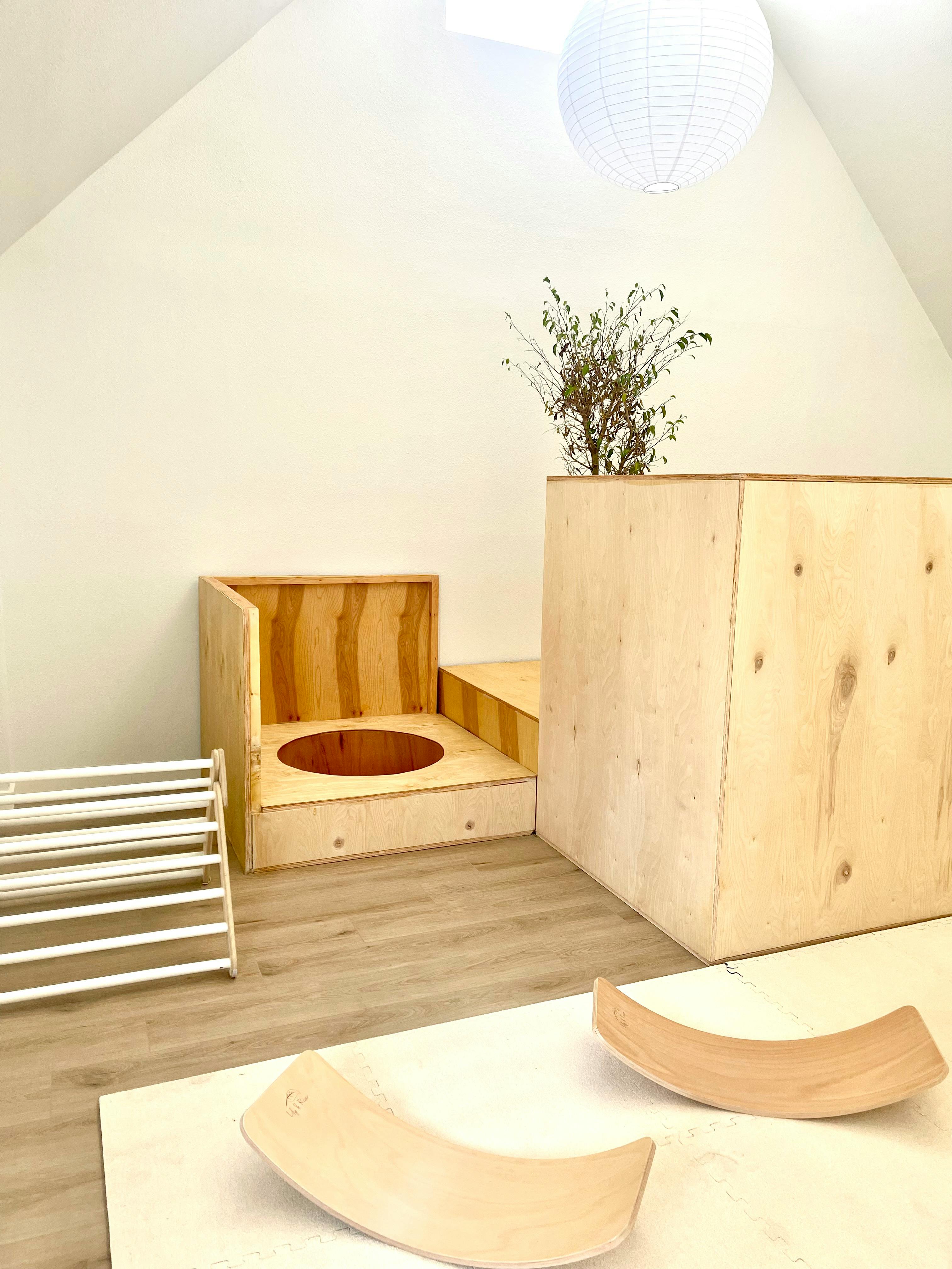 Wooden play structures and balance boards in a room