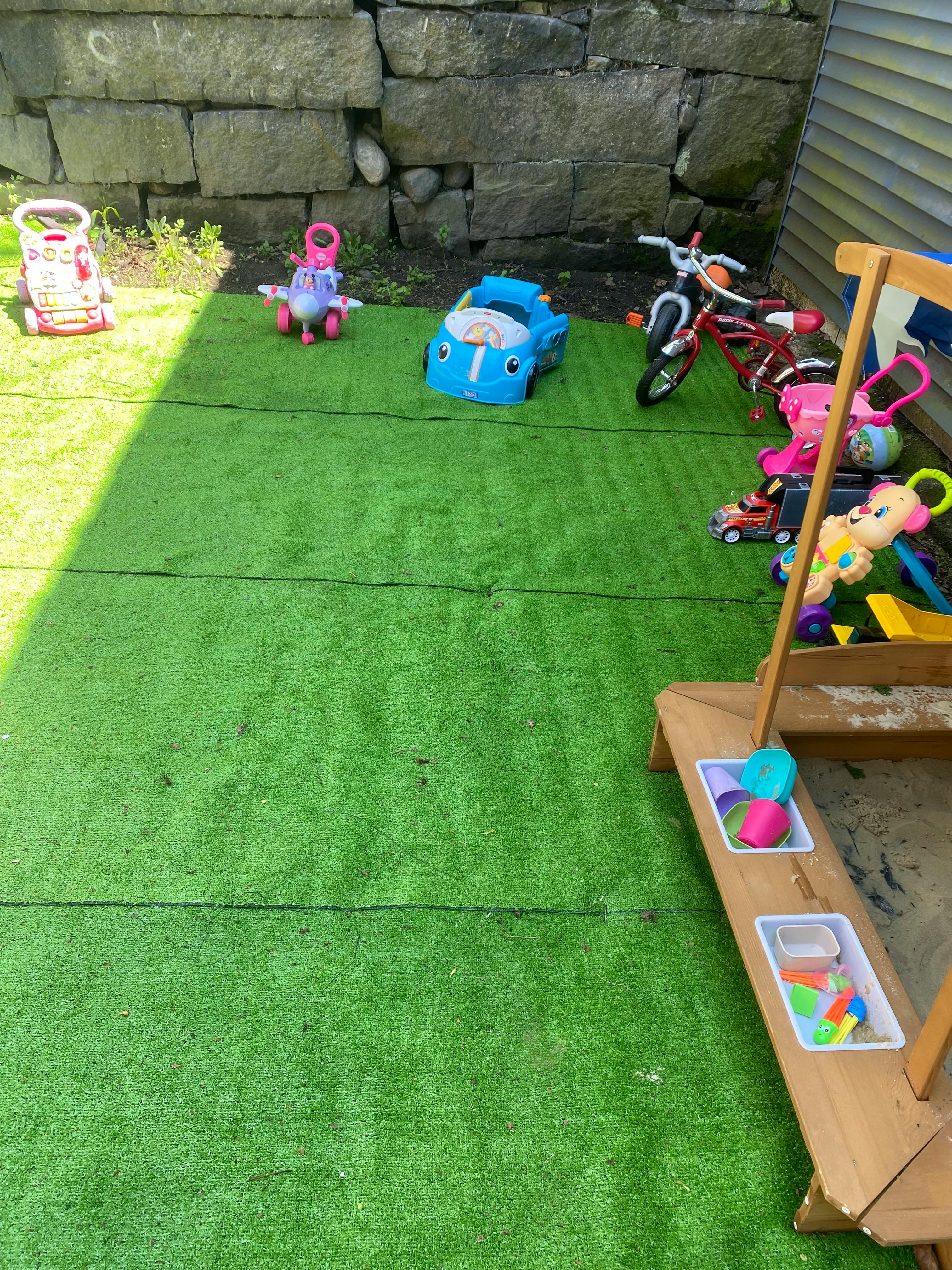 Playground with various toys and artificial turf