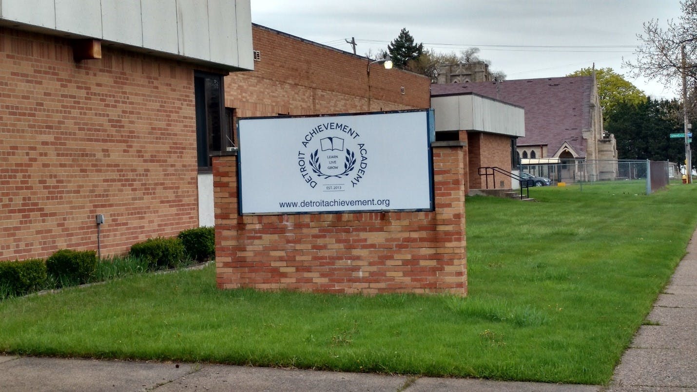 Sign with text "First Presbyterian Church" on brick base