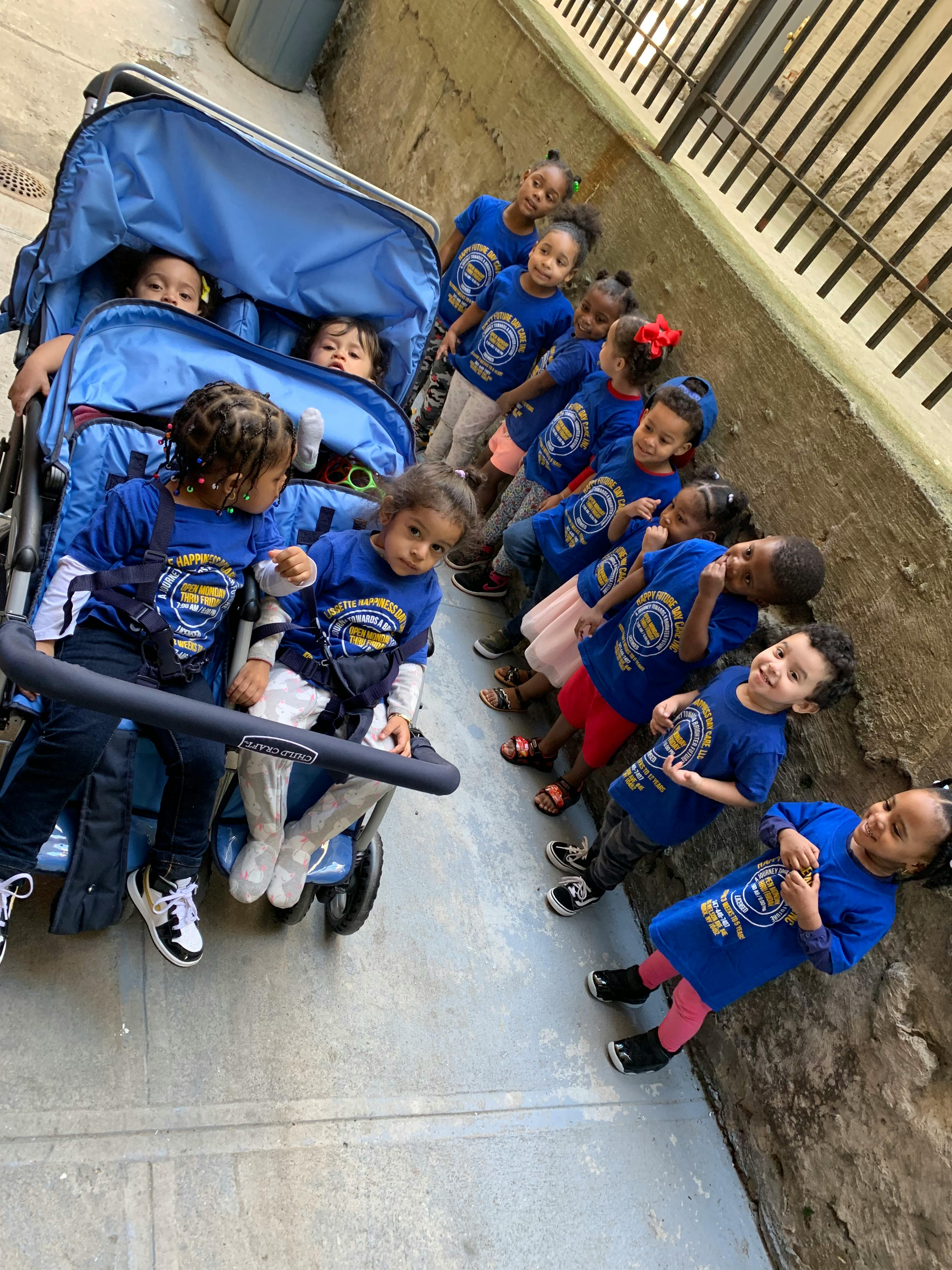 Group of children and babies in a stroller