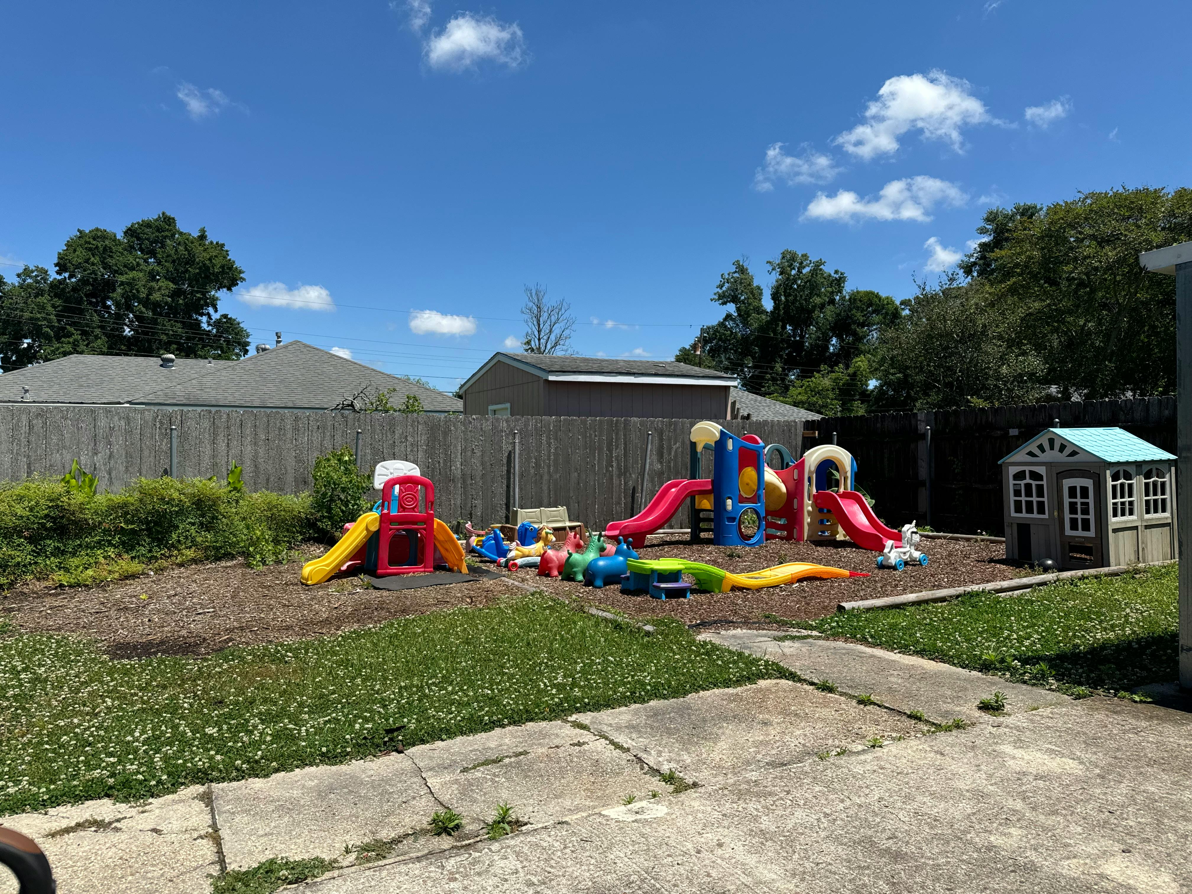 Outdoor playground with slides and playhouses