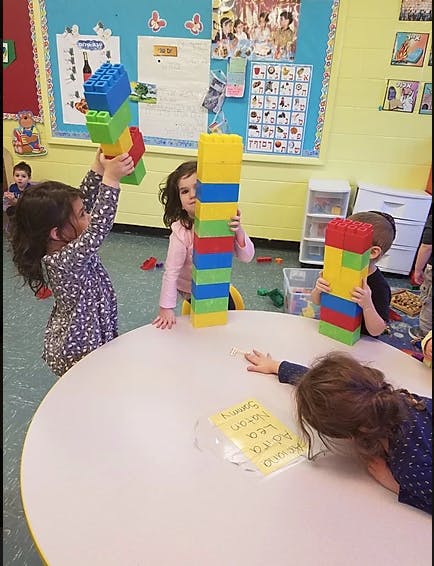 Children playing with large colorful building blocks