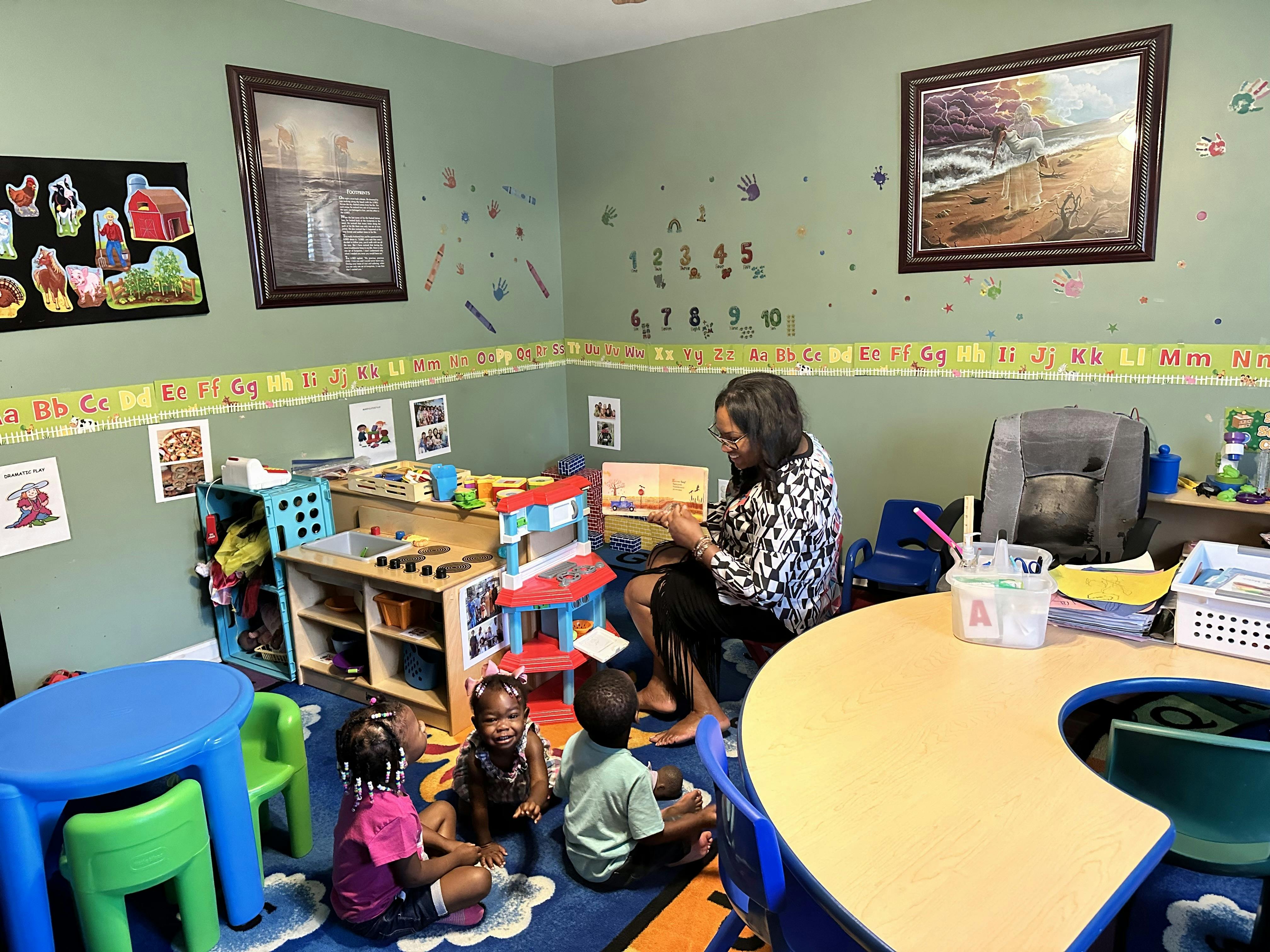 Person reading to children in a classroom