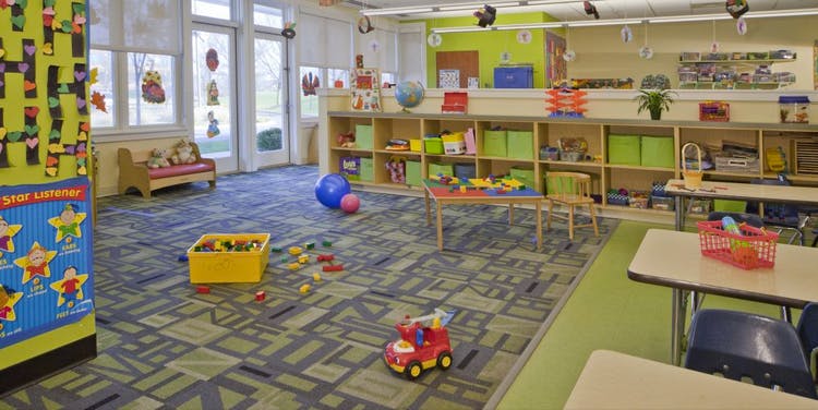Playroom with toys on the floor and shelves