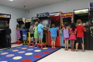 Children playing arcade games
