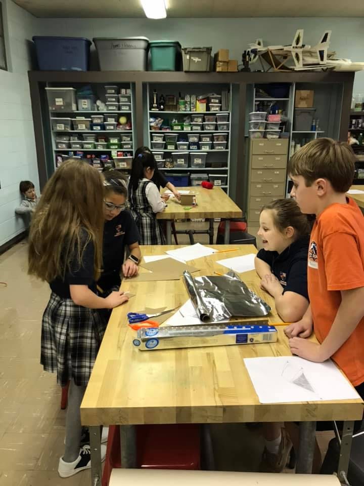 Children working at tables in a classroom
