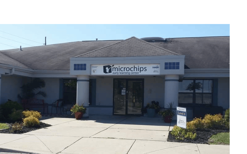Exterior of Microchips Early Learning Center building with sign
