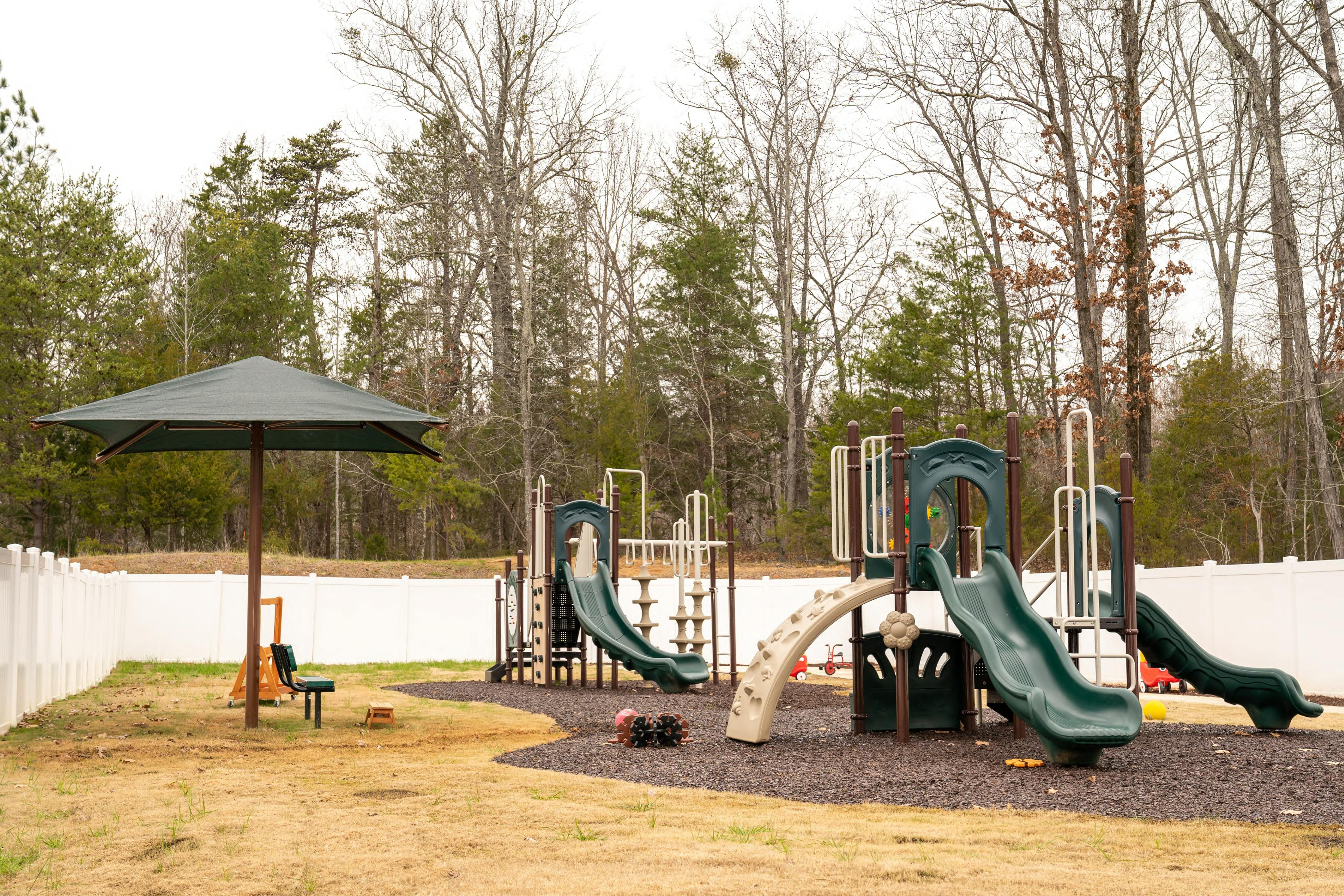 Outdoor playground with slides and climbing structures