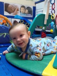 Child on stomach on a mat