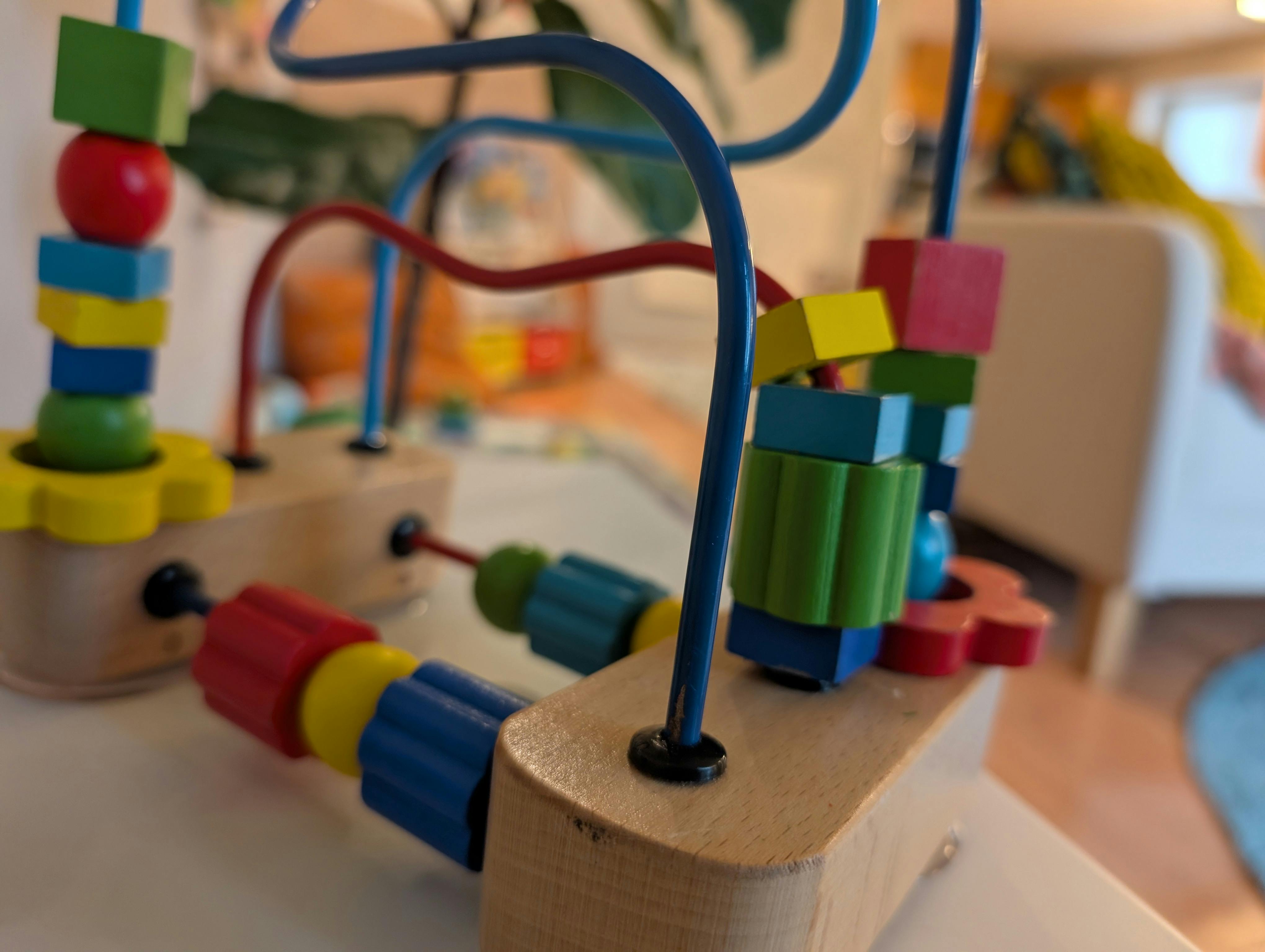 Wooden bead maze toy with colorful beads