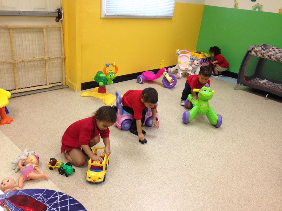 Children playing with toys in a room