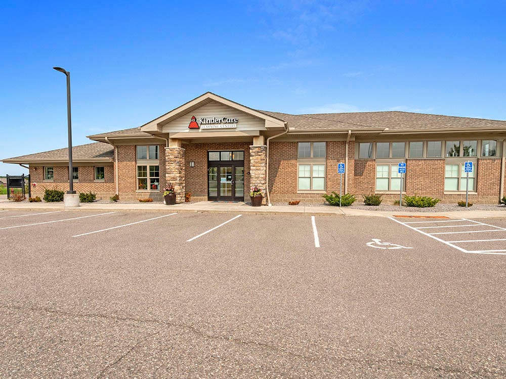 KinderCare Learning Center building with parking lot and handicapped parking spaces