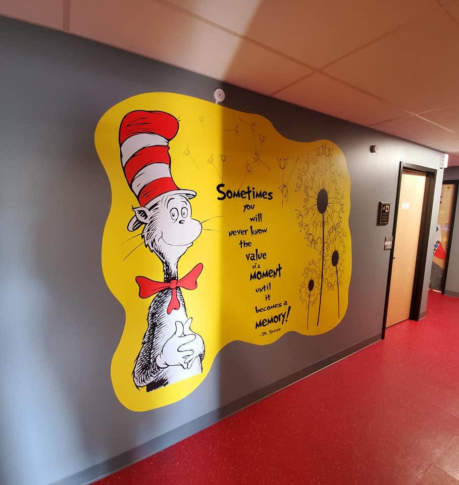 Cat in the Hat mural with text on a wall