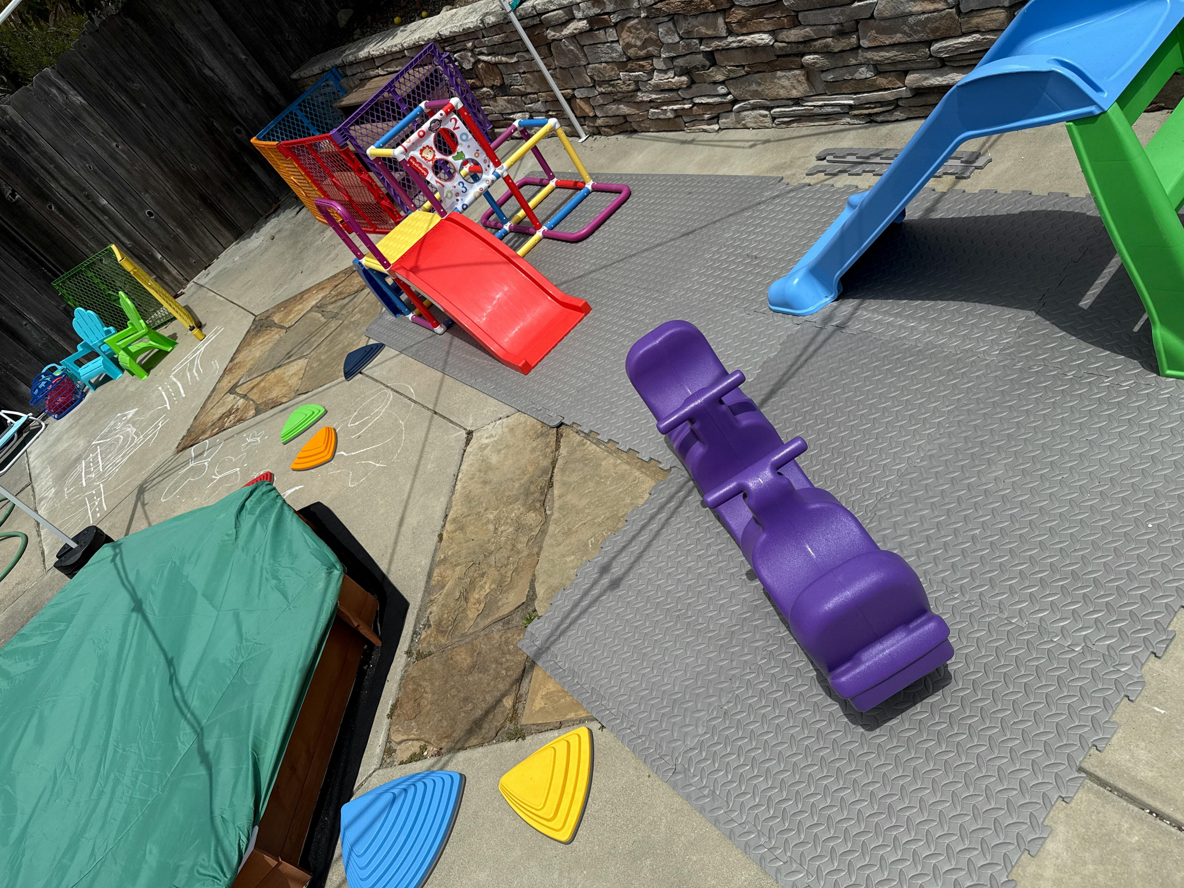 Playground with slides and a seesaw