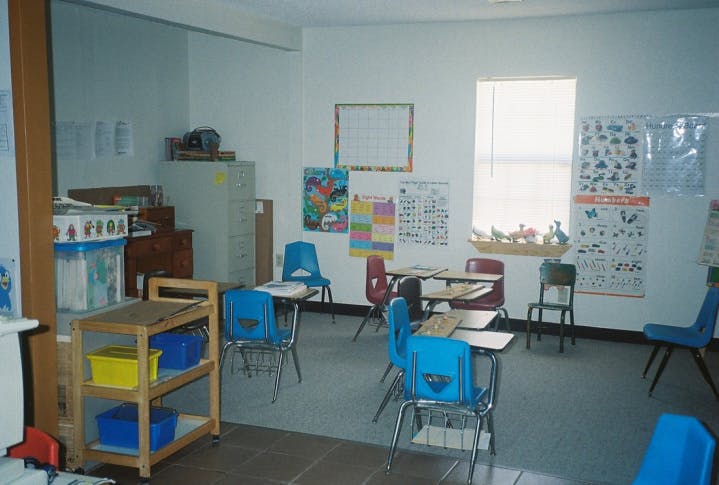 Empty classroom with desks and chairs