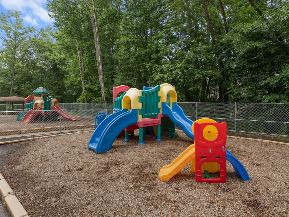 Colorful playground equipment with slides and climbing structures