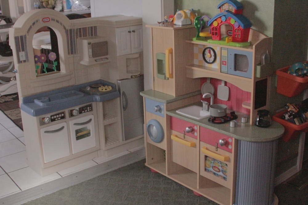 Two toy play kitchens