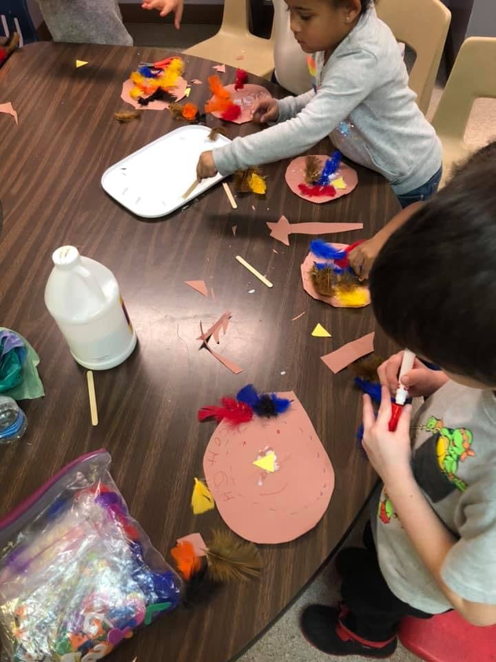 Children doing crafts at a table