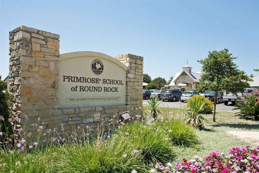 Stone sign for Primrose School of Round Rock with landscaping