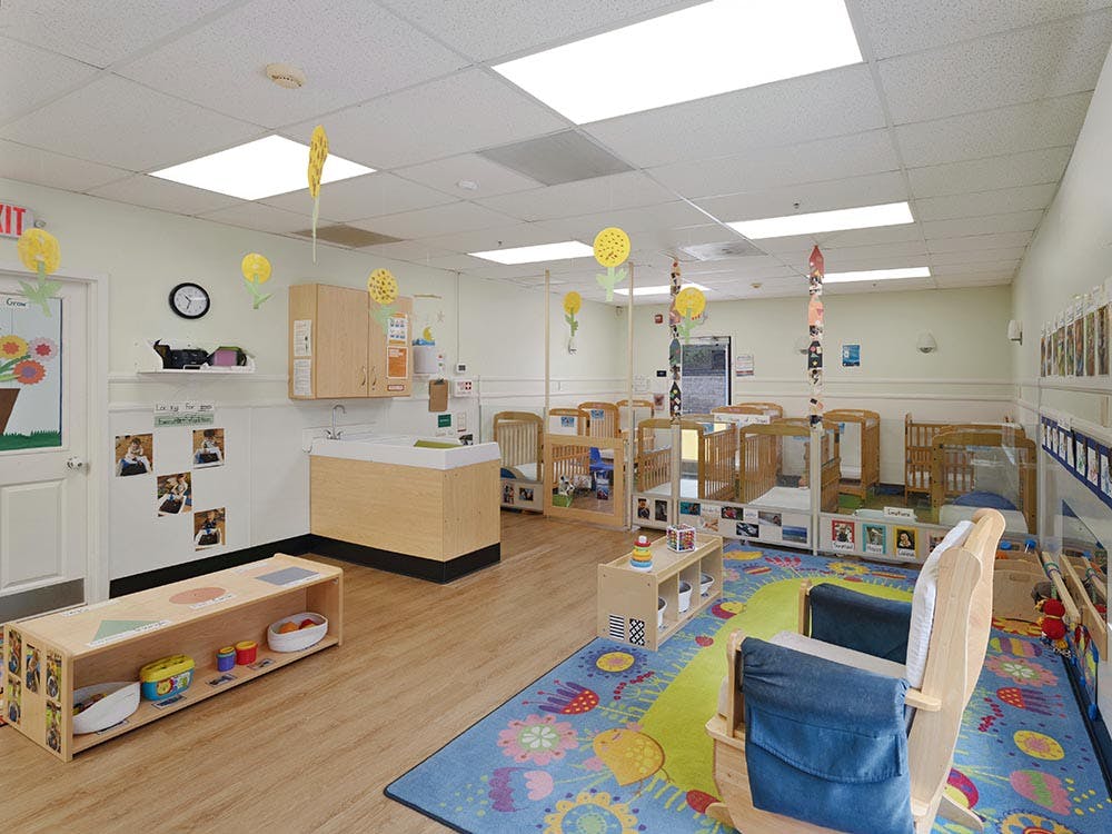 Classroom with multiple cribs and changing station