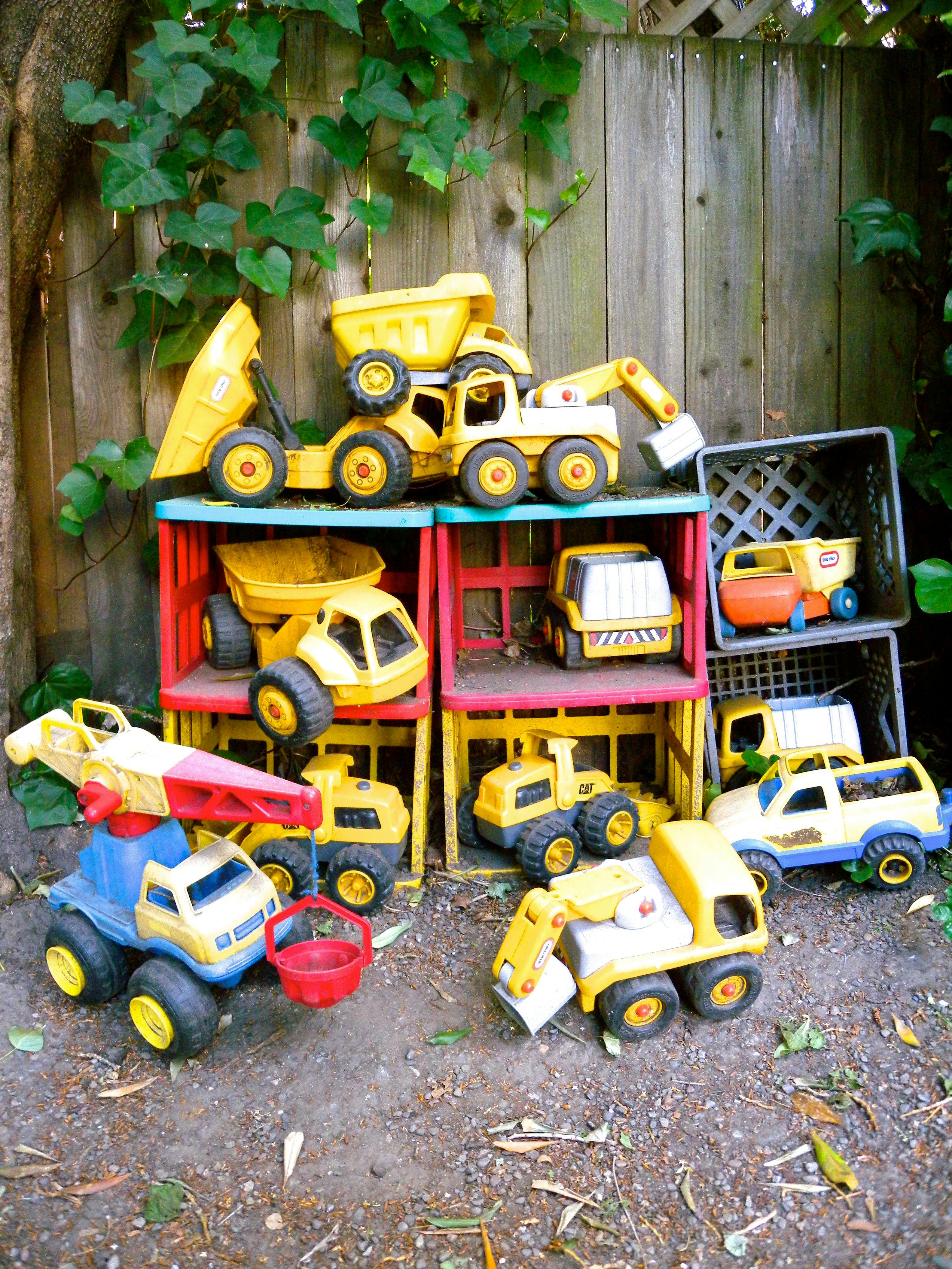 Collection of yellow toy construction vehicles and trucks