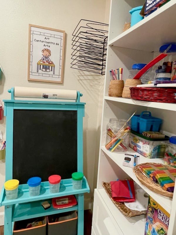 Art supplies and a child's easel with a chalkboard