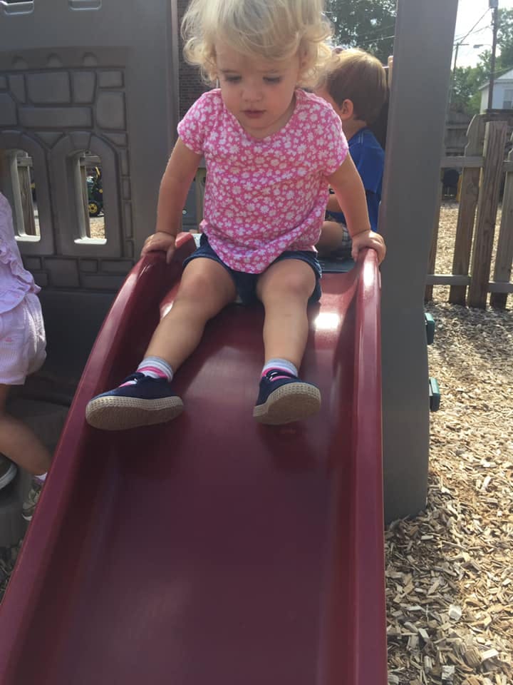 Child on a slide in a playground