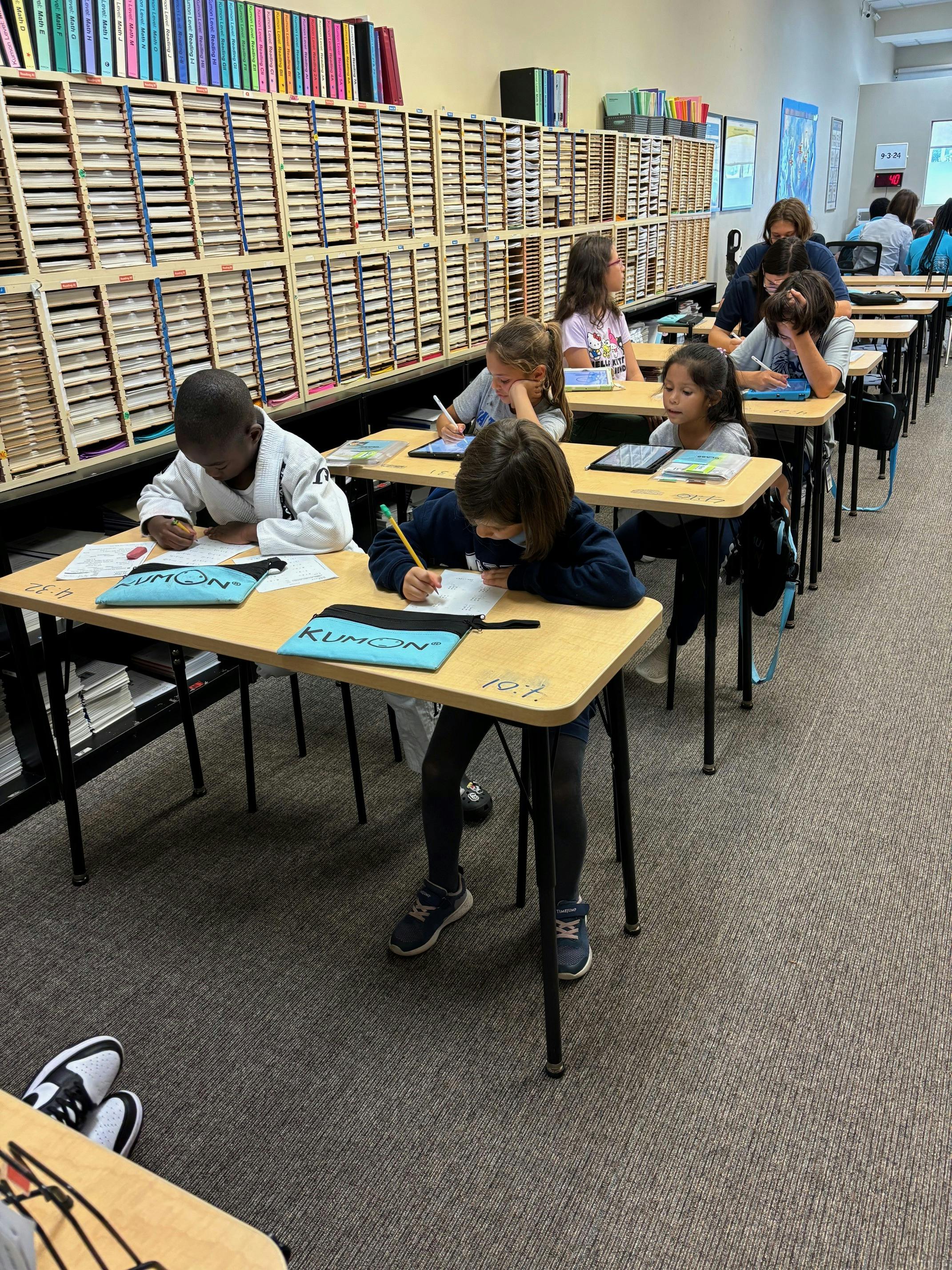 Children in a classroom working at individual desks