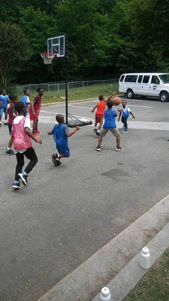 Children playing basketball outdoors