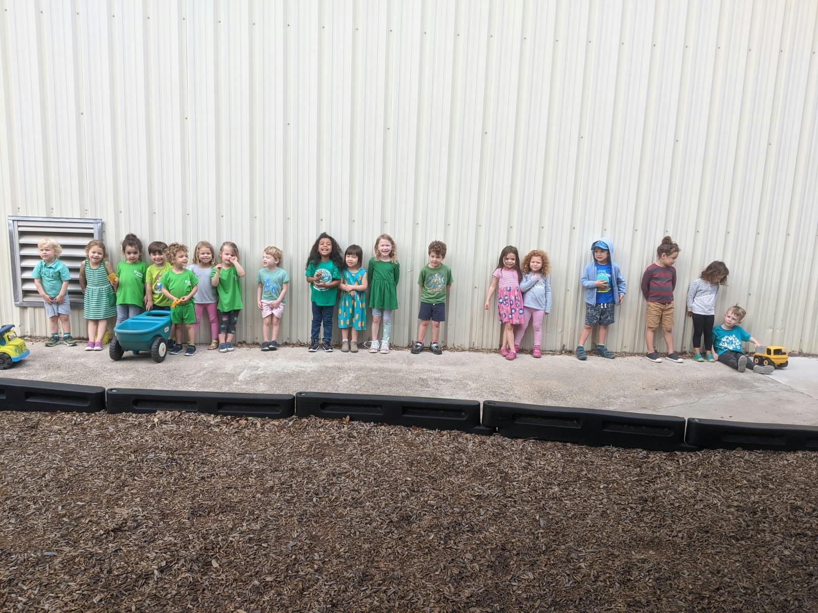 Group of children standing in a line outdoors