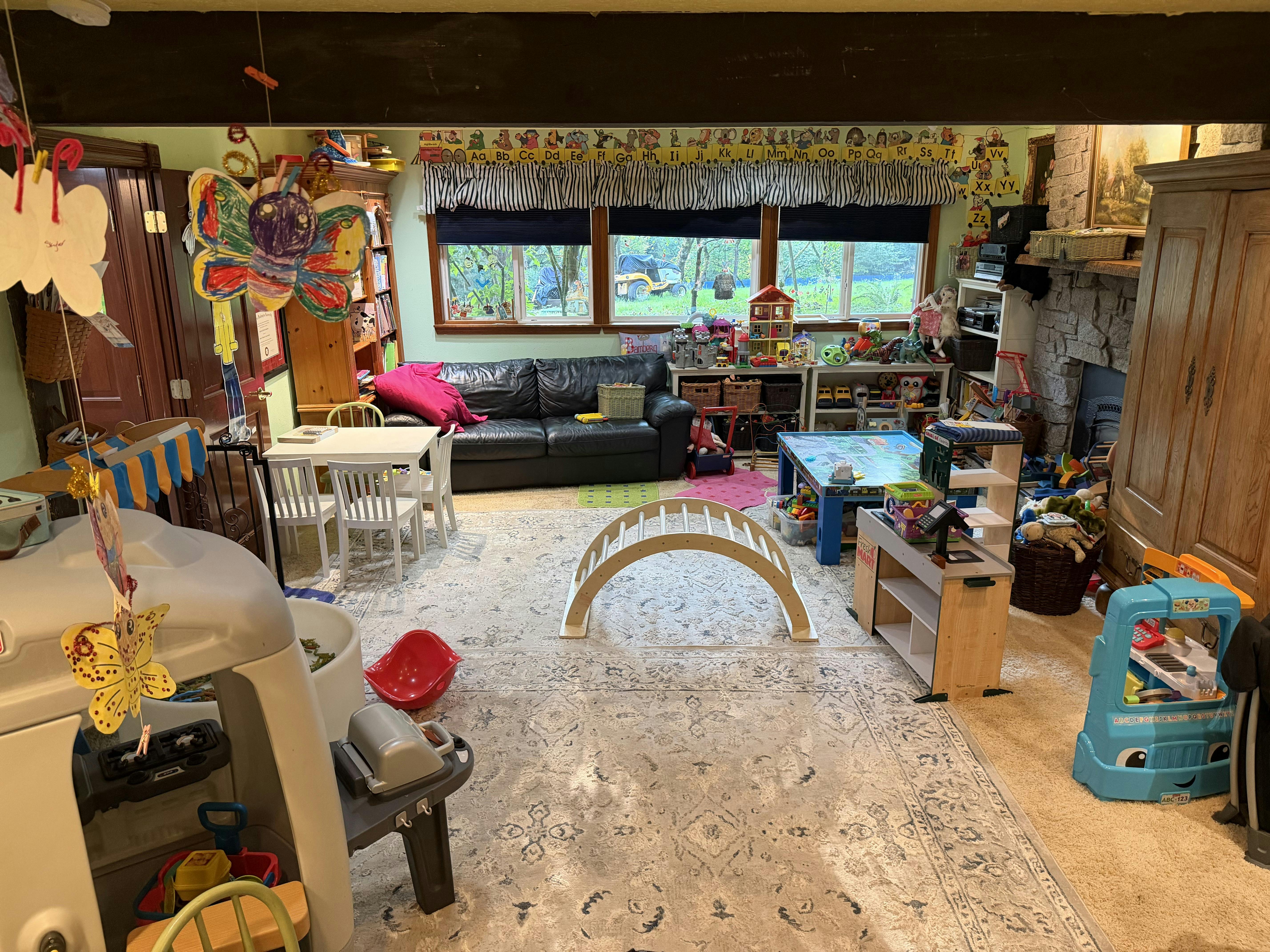 Playroom filled with children's furniture and toys
