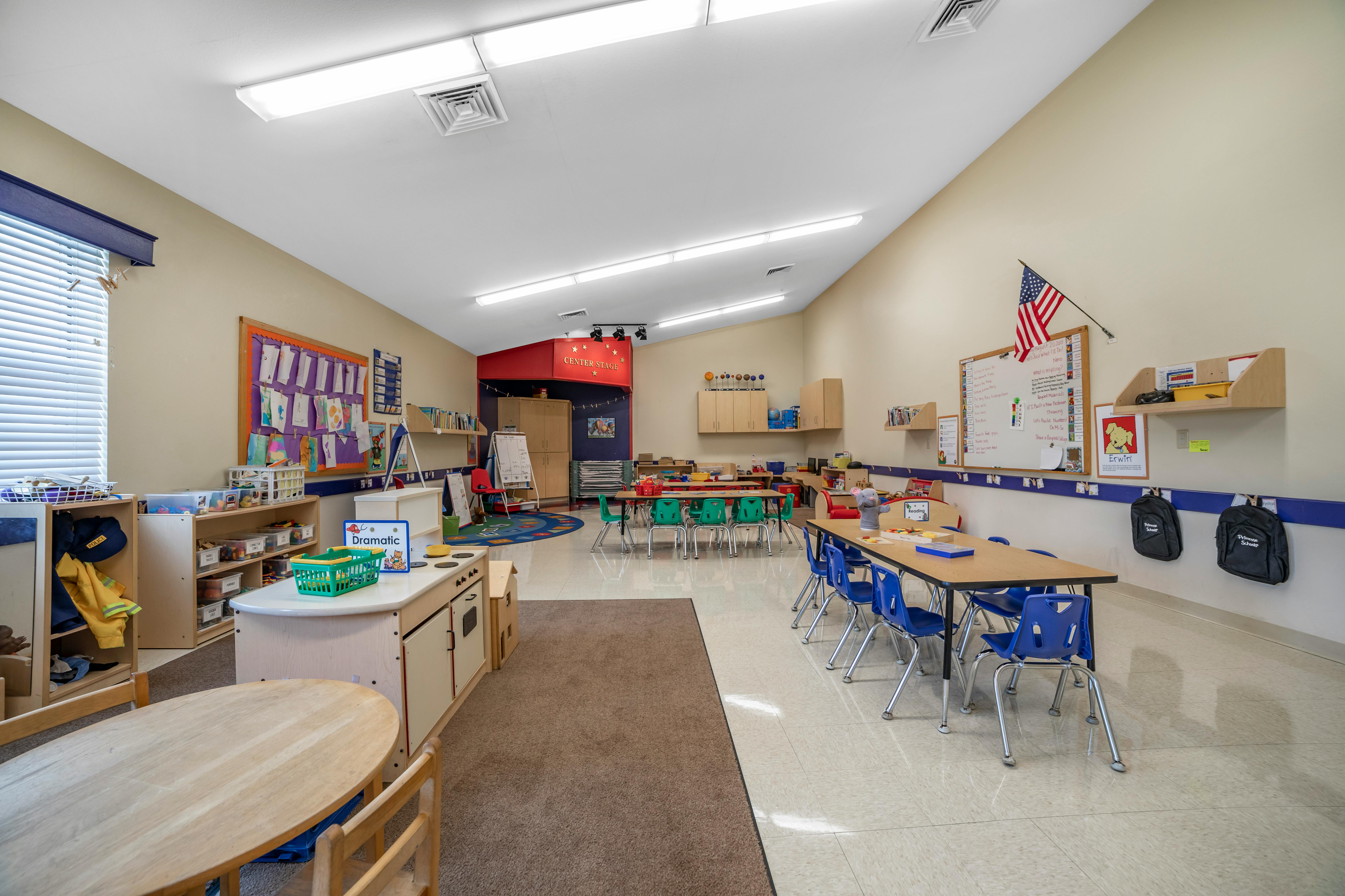 Classroom with tables, chairs, and learning materials