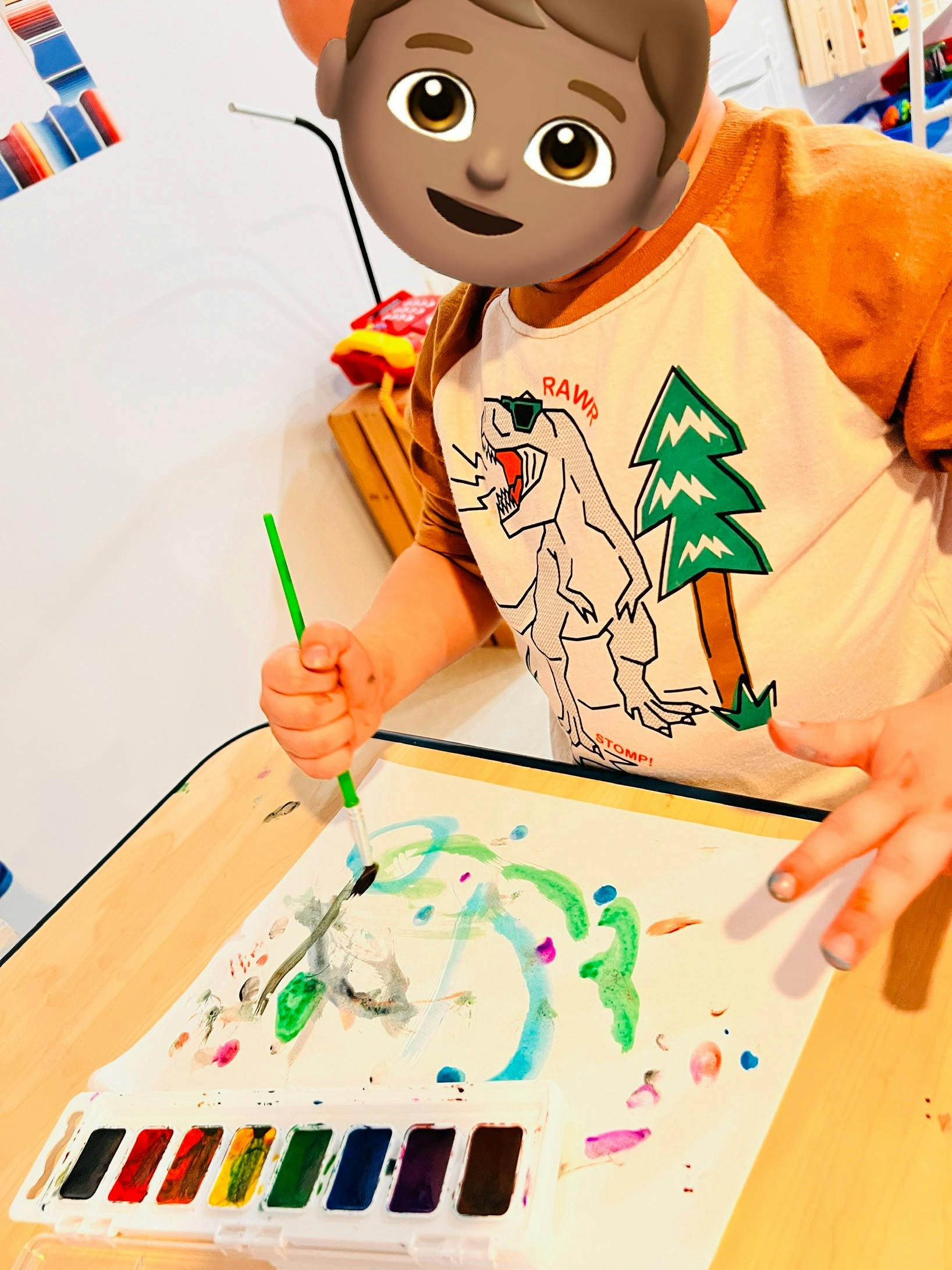 Child painting with watercolors