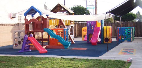 Outdoor playground with multiple slides and play structures