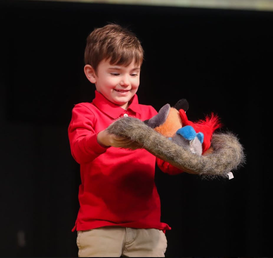 Child holding a puppet
